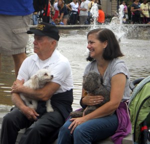 Two poodles with their owners