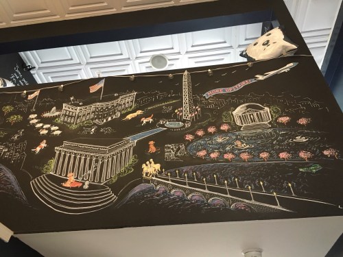 chalk mural with washington,  DC  monuments and dogs